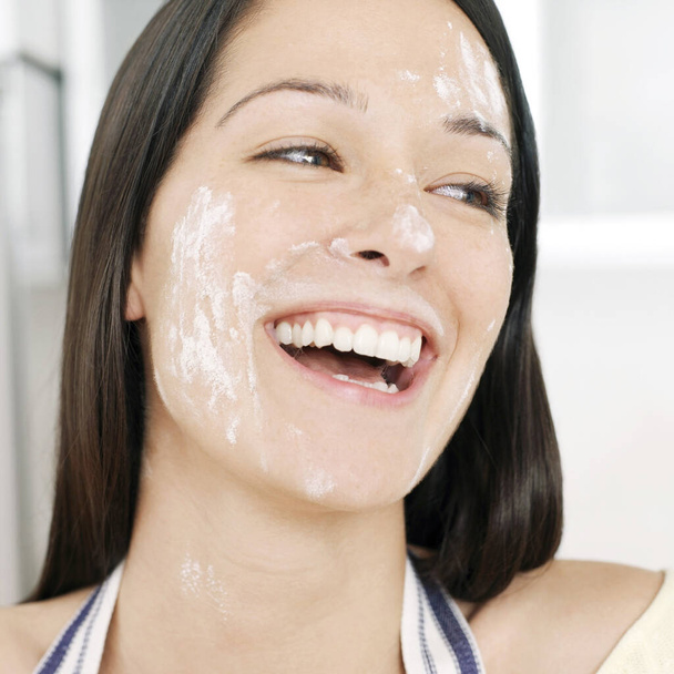 Woman with flour on her face - Foto, Bild