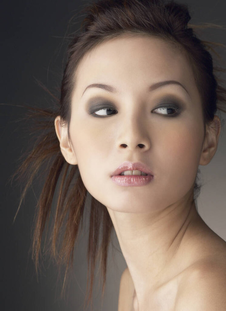 Studio shot of a lady with makeup and hairdo - 写真・画像