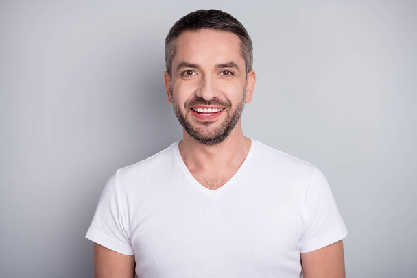 Close-up portrait of his he nice attractive content cheerful cheery bearded guy sportsman wearing tshirt isolated over light grey pastel color background - Фото, зображення