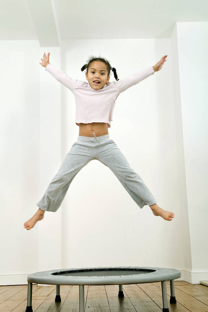 Kid jumping happily beautiful - Foto, immagini