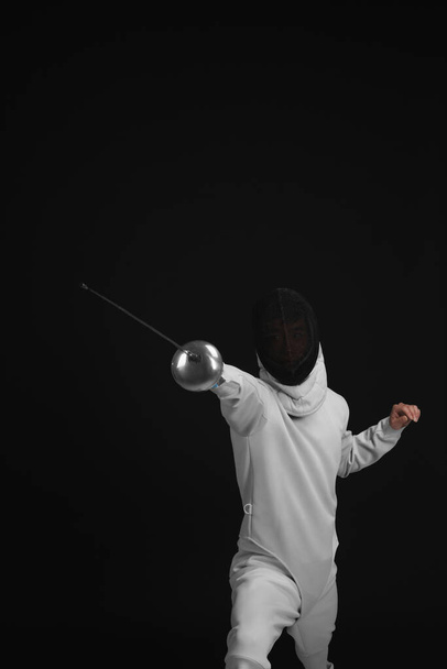 Man holding fencing foil - Foto, imagen