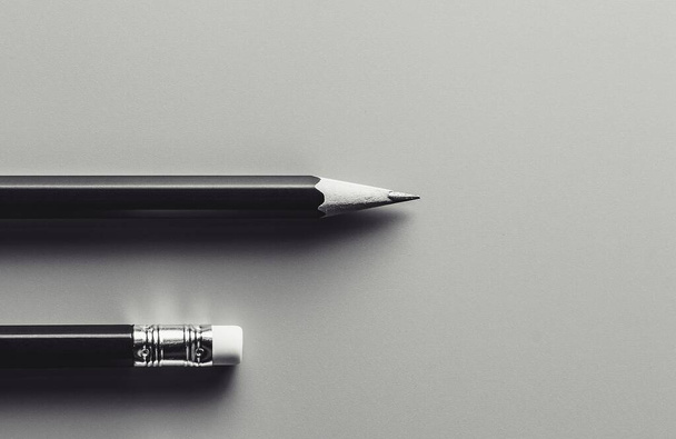pencil and eraser. - monochrome background. - Business concept. - Фото, изображение