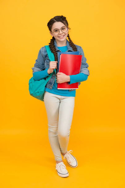 Make school time better. Little child hold bag and books. Happy kid back to school. September 1. Knowledge day. Education and study. Startup. Shop for school essentials. School sale - Fotoğraf, Görsel