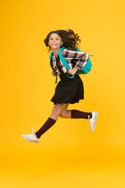 Break into next academic year. Daily school life. Inspired for studying. Teen fashion. Schoolgirl modern clothes with cute backpack. Backpack fashion accessory. Girl cheerful face carry backpack - 写真・画像
