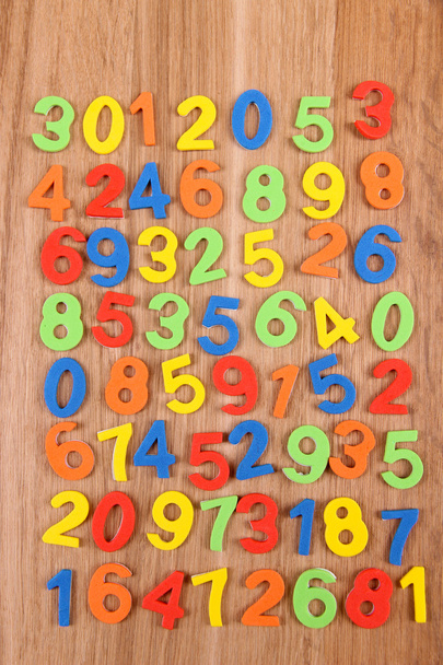 Colorful numbers on wooden background - Photo, Image