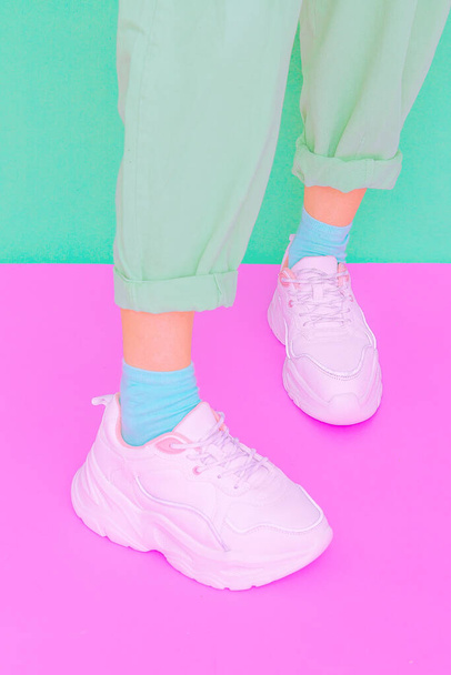 Stylish white shoes. Sneakers. Minimal aesthetic pastel monochrome design.  ideal for bloggers, websites, magazines, business owners, instagram fashion page - Foto, Imagem