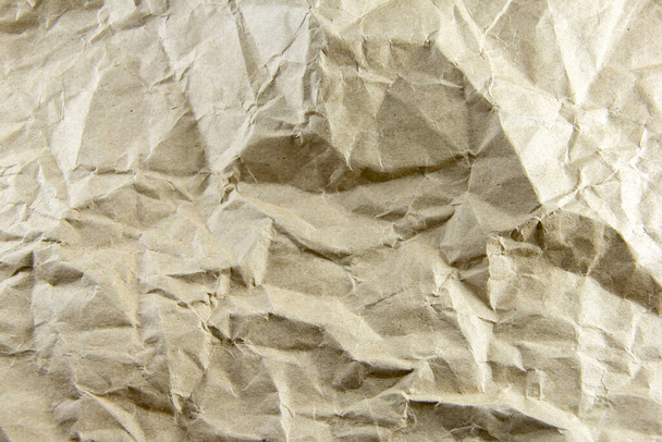 Braune Papierfolie Zerknüllte Papieroberfläche als Hintergrund nutzen Raum für Werbebotschaften - Foto, Bild