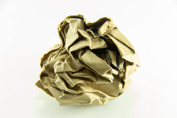 Paper ball - Crumpled sheet of free hand script writing paper isolated ., A screwed up piece of paper in round shape., Junk paper can be recycle on white background. - Photo, Image