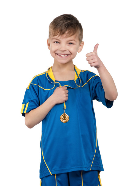 Niño en uniforme de fútbol nacional ucraniano
 - Foto, Imagen