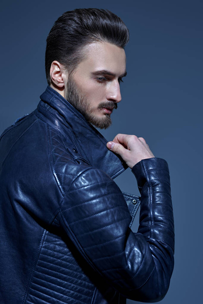 Men's fashion. Portrait of a handsome man in black leather jacket. Studio portrait.  - Fotografie, Obrázek