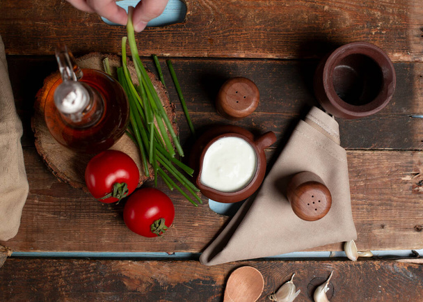 yogurt and tomato with wooden background - Fotoğraf, Görsel