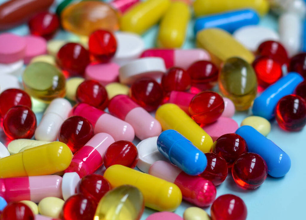 Multi-colored tablets, capsules, vitamins, supplements. ?oncept of treatment and healthcare. Flat lay. - 写真・画像