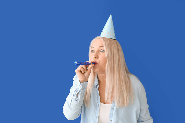 Mature woman celebrating Birthday on color background - Photo, Image