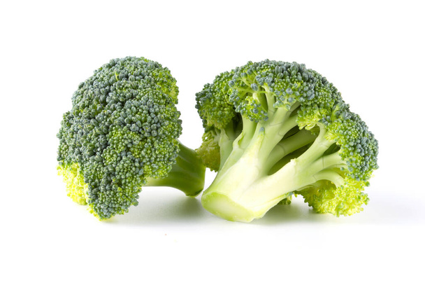 Fresh green tasty broccoli in closeup isolated on white background - 写真・画像