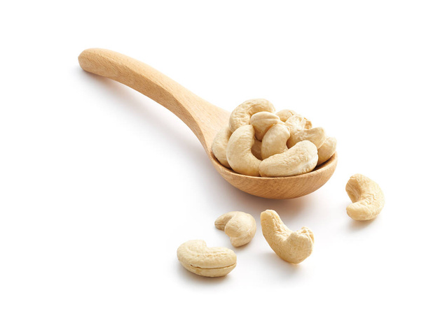 Cashew Nuts on wooden spoon isolated over white background - Photo, Image