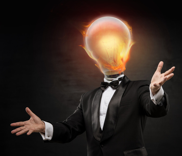 Businessman with burning lamp head - Zdjęcie, obraz