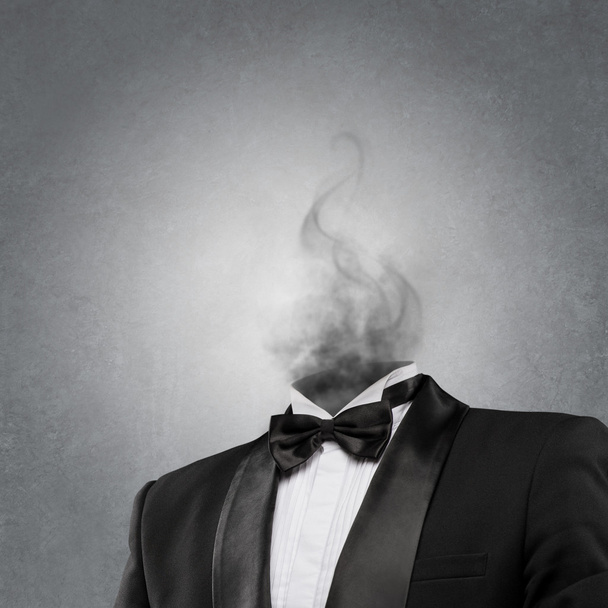 Overworked burnout business man standing headless with smoke instead of his head. Strong stress concept - Foto, immagini