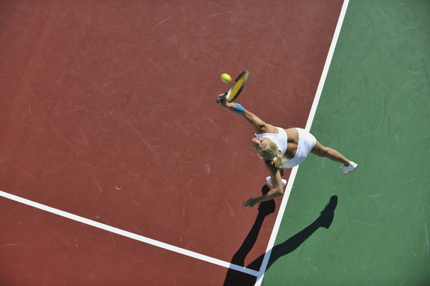 Young woman play tennis - Фото, изображение