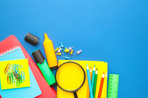 School supplies on blue background. Back to school. Flat lay. Top view - Foto, immagini
