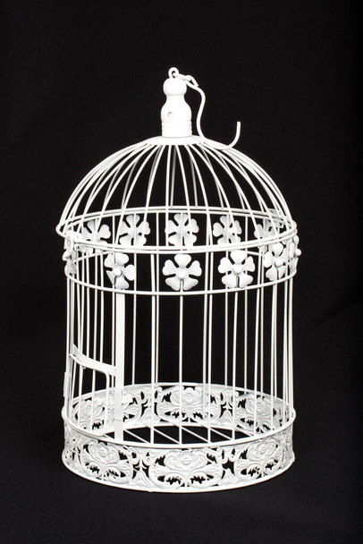 white bird cage on black background  - Fotó, kép