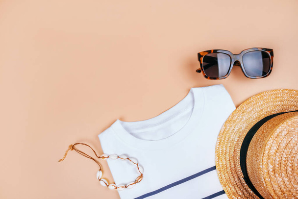 Summer fashion flatlay with t-shirt and sunglasses - Photo, Image
