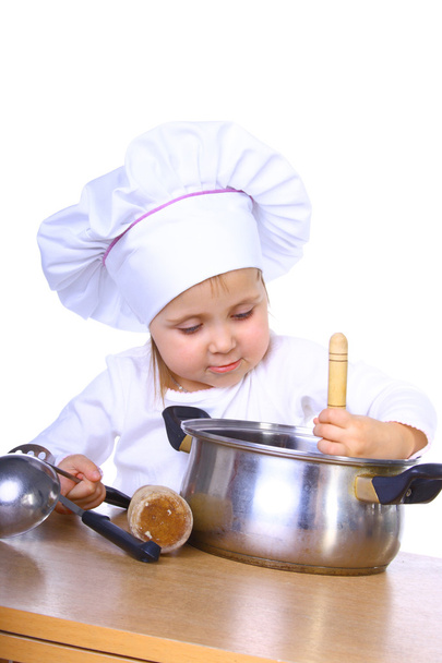 kleine baby iets koken - Foto, afbeelding