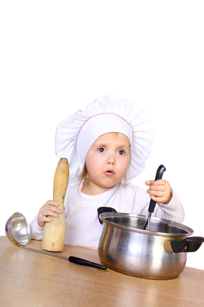Little baby cooking something - Foto, afbeelding