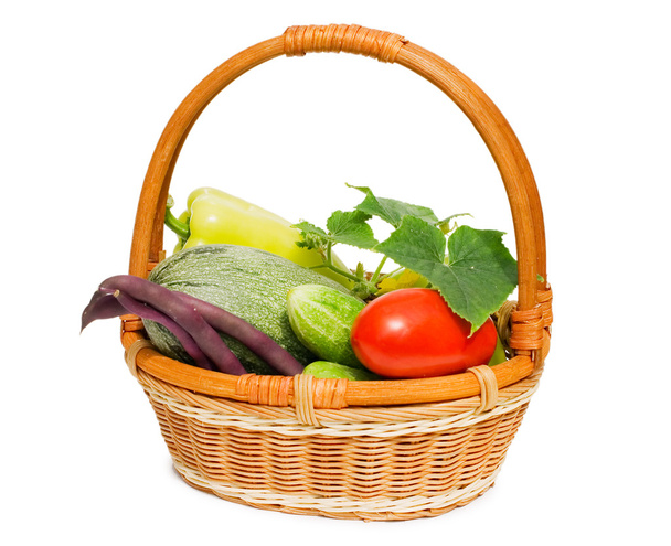 Wattled basket with vegetables isolated on white - Foto, Imagem