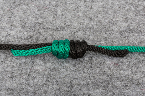 knot on a grey background - Foto, Imagen