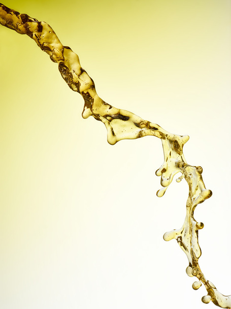 Beer - juice - oil is pouring. Jet isolated. Clipping path - Foto, Bild