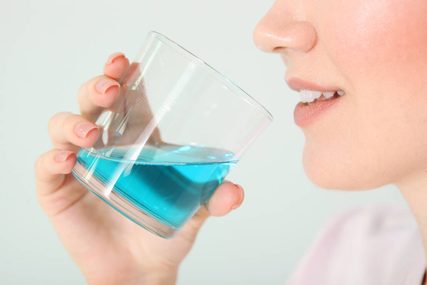 young girl uses mouthwash at home - Photo, Image