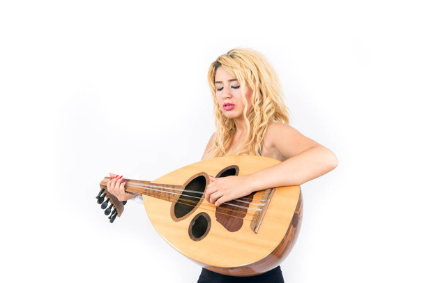 Blonde lady playing the oud musical instrument - Foto, Imagem