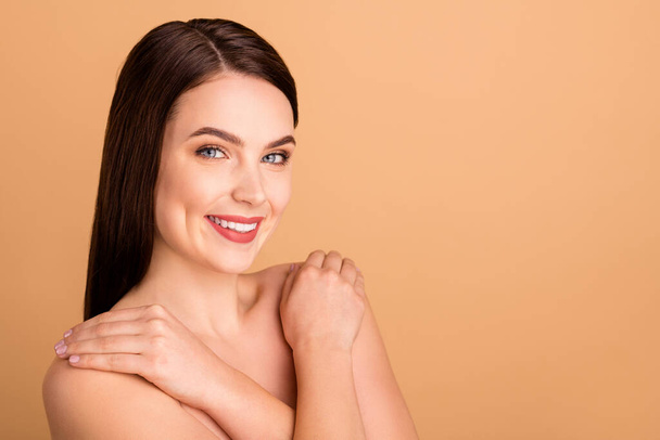 Close up photo of positive girlish lady hug herself enjoy new spa salon treatment to make skin pure perfect ideal isolated over pastel color background - Fotografie, Obrázek