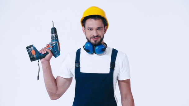 handyman in workwear with screwdriver isolated on white - Footage, Video