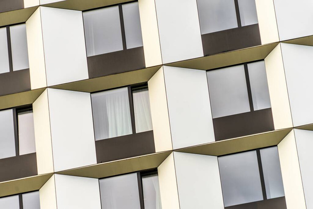 A closeup shot of a facade of a modern building with wide windows - Fotografie, Obrázek