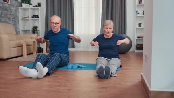 Cheerful senior couple exercising - Кадри, відео