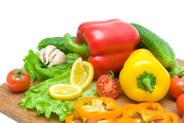vegetables on a cutting board on a white background - Zdjęcie, obraz