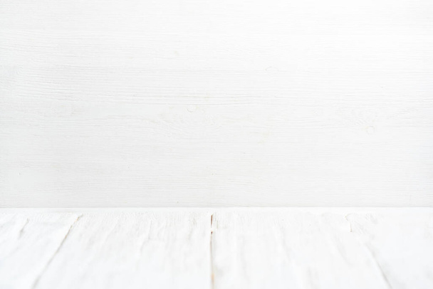 White wooden table top on white wall background. - Фото, изображение