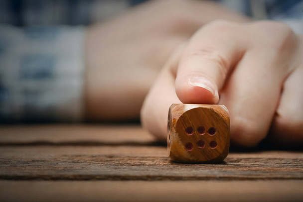 The dice in female hand close up. - Zdjęcie, obraz
