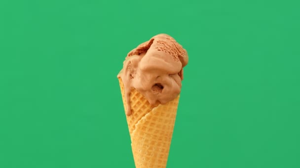 Time-lapse of melting ice cream cone on a green background, 4K - Footage, Video