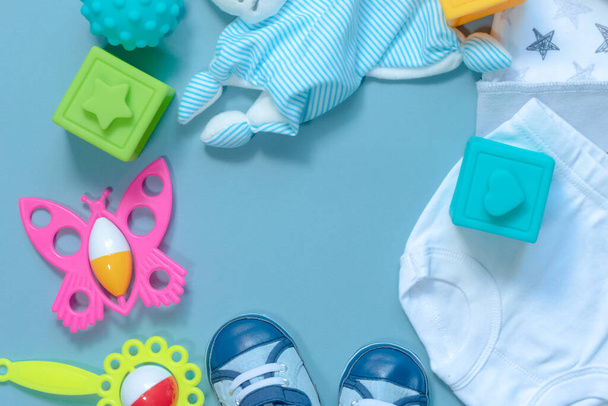 Baby clothes and toys abstract background with a copy space. - 写真・画像