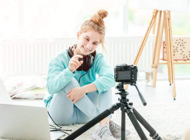 Happy teenage girl shooting vlog - Valokuva, kuva