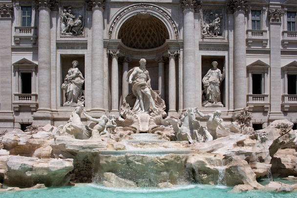 Summer day view of Fontana Di Trevi in Rome. Aqueduct-fed rococo fountain, designed by Nicola Salvi & completed in 1762, with sculpted figures. - Фото, изображение