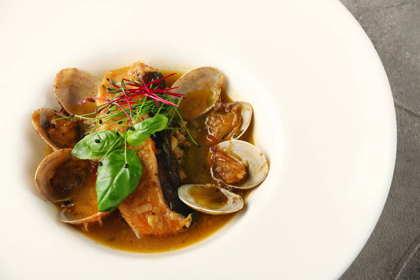 steamed mussels with salmon in white plate with white wine. Classic French or American restaurant appetizer - Photo, Image