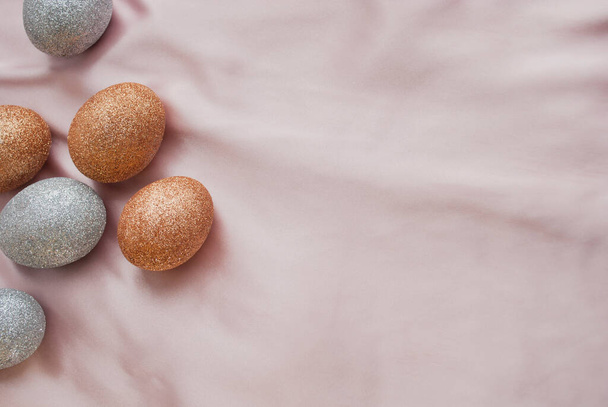Glitter Easter eggs on a pink background - Fotoğraf, Görsel