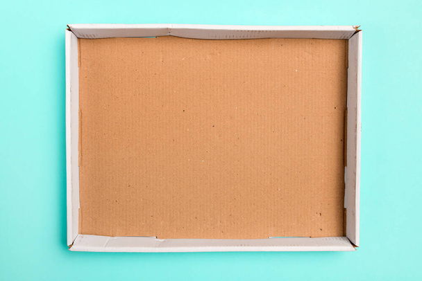 Top view of empty cardboard box as mock up copy space, overhead shot of worn rectangular cardboard container - Photo, Image