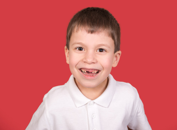 boy portrait in white shirt on red - Photo, Image