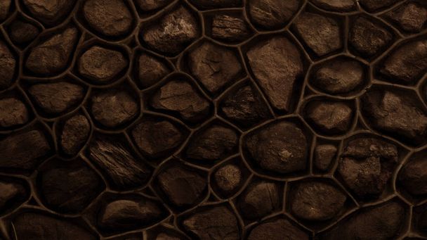 Dark brown wall made of stone and cement. Mosaic of rocks used as tiles. Toned dark sepia stone fence. Decorative texture from natural material. Background, pattern, texture. - Foto, Bild