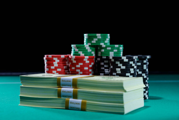 Casino and US Dollars chips on a gaming table - Photo, Image