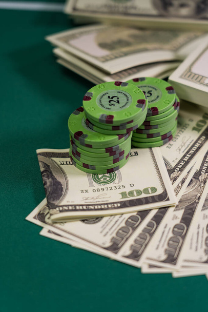 Casino and US Dollars chips on a gaming table - Valokuva, kuva